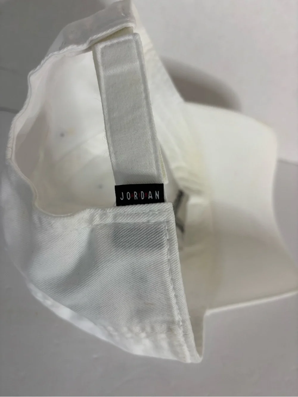 Jordan White Low-Profile Strapback Cap with Black Logo Tab